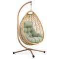 Poltrona sospesa in rattan sintetico con cuscino verde