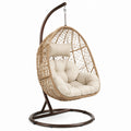 Poltrona sospesa in rattan con cuscino in poliestere e struttura in metallo