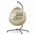 Sedia sospesa in rattan con cuscino in metallo, verde